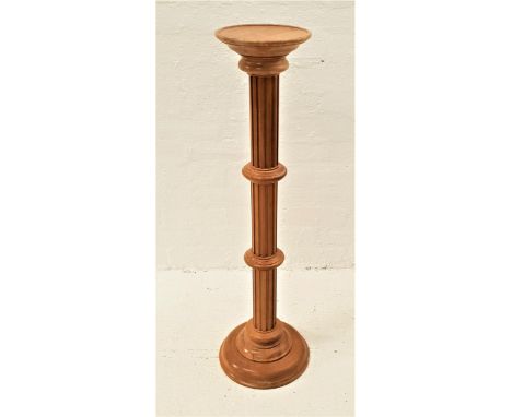LIGHT OAK TORCHERE STANDraised on a circular base with a grooved column, 100cm high 