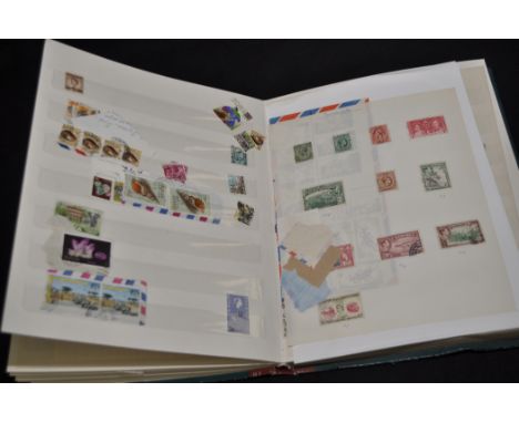 A stamp album containing mainly Commonwealth stamps, mid 20th Century, some mint. 