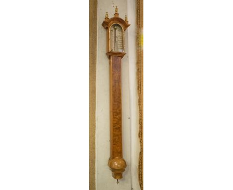 STICK BAROMETER, by Comilli Holborn, burr walnut, 105cm H x 18cm W.