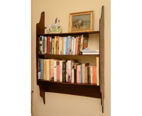 A hanging oak wall shelf,19th century, with shaped ends and three shelves,79cm wide17cm deep117cm highCondition report: Gener