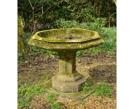 An octagonal carved marble font,19th century, on a faceted column and a stepped base,107cm diameter85cm highCondition report: