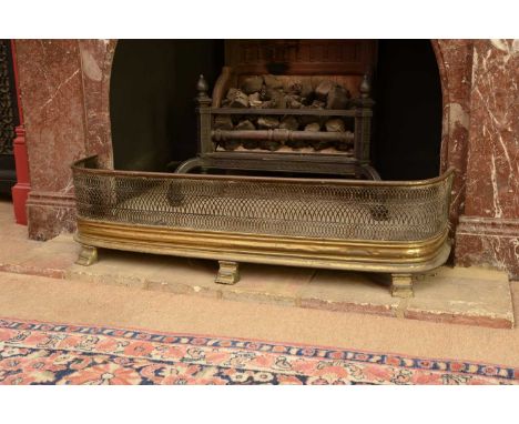A brass fender,19th century, with a pierced grille and three outswept supports,106cm wide27cm deep27cm high,together with a f