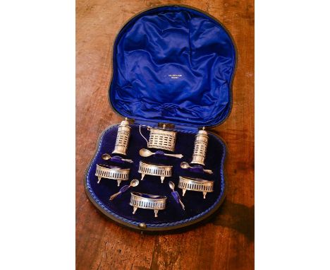 A cased Edward VII silver cruet set,William Aitken, Chester 1901,comprising a mustard pot, a pair of pepperettes, four open s