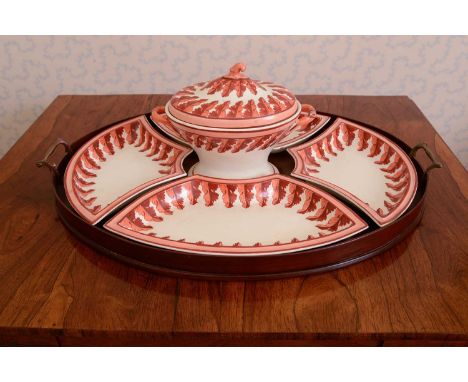 A creamware supper set,19th century, comprising a tureen and cover with removable cruet stand, and four shaped dishes, the tu