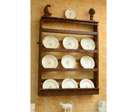 An oak hanging plate or delft rack,possibly 17th century, with linear decoration,75cm wide15cm deep92cm highCondition report: