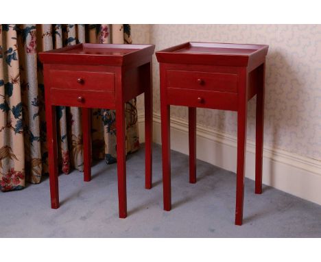 A pair of modern red-painted bedside or side tables,the square tray tops above two drawers and raised on square supports,41cm