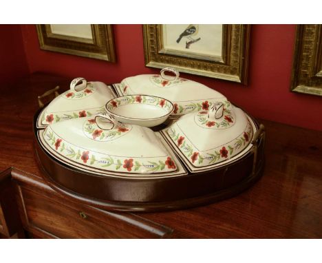 A Davenport creamware supper set,early 19th century, comprising four shaped lidded dishes and an oval comport within a mahoga