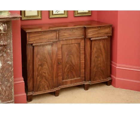 A George IV mahogany sideboard,the inverted breakfront top above three frieze drawers and three cupboards, the right-hand exa