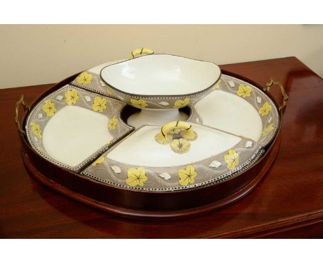 A pearlware dinner set on tray,early 19th century, consisting of two covered dishes, two open dishes and a comport, each deco