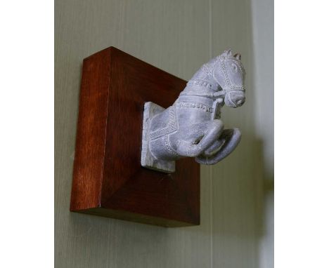 A pair of modern Indian carved soapstone robe hooks,each in the form of a horse, on a mahogany board,13cm wide15cm deep15cm h