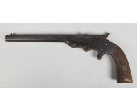 A late 19th century rimfire boot pistol. With knurled walnut scales and octagonal barrel. Barrel length 23.75cm.