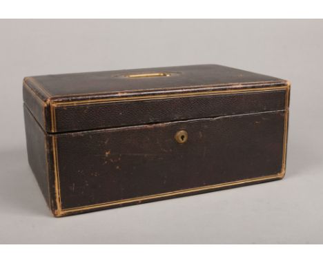 A Victorian leather mounted and fitted writing case with gilt embellishments and Bramah lock. Housing a pair of gilt metal in
