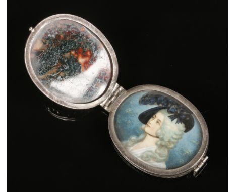 A 19th century Hanau silver mounted ovoid locket by Gebruder Dingeldein. Decorated with Watteaesque figures and opening to re