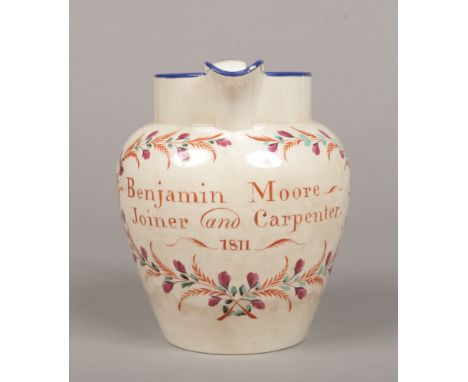 A documentary Don pottery jug. Inscribed Benjamin Moore, Joiner and Carpenter, 1811, within a flower wreath, with two rose sp