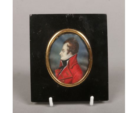 A Regency portrait miniature of a gentleman wearing a red overcoat and in ebonized frame. Signed Villers.