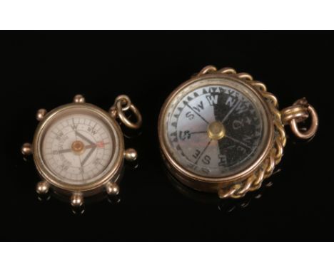 Two 9 carat gold mounted compass pocket watch fobs.&nbsp;Condition report intended as a guide only.Good condition. Compasses 