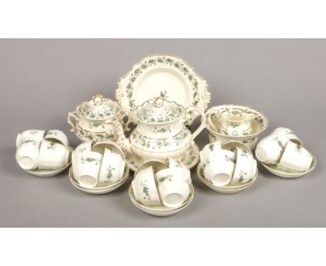 A comprehensive Rockingham tea and coffee service. Printed in green with trailing vines and highlighted with gilt bands. Comp