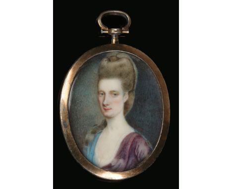 An English portrait miniature of a lady in yellow metal pendant mount c.1680-1730, 36mm x 29mm.