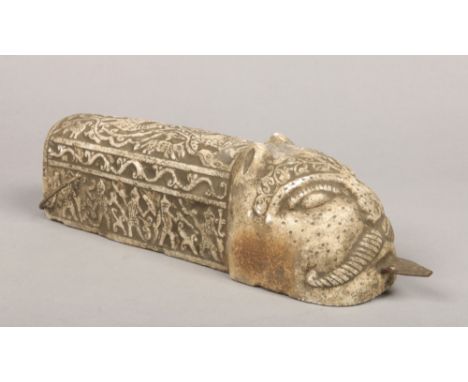 An Indo Persian style stone carving of a Pata (gauntlet sword). Decorated in light relief with bands of stylized figures and 