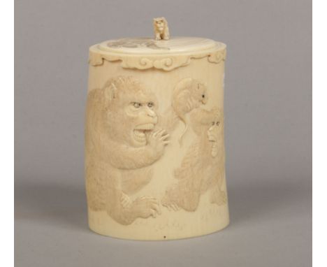 A Japanese Meiji period ivory tusk jar and cover. Carved in light relief with three chimpanzees and a rat under a cloud scrol