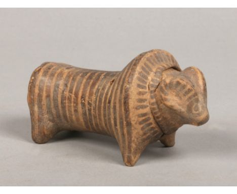 An Indus Valley terracotta model of a ram with painted detail, 13cm.