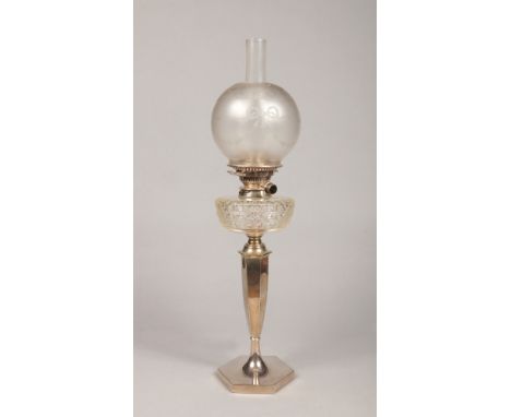 An Edwardian oil lamp by Hawksworth Eyre &amp; Co. With frosted glass shade, cut glass font and raised on a hexagonal silver 