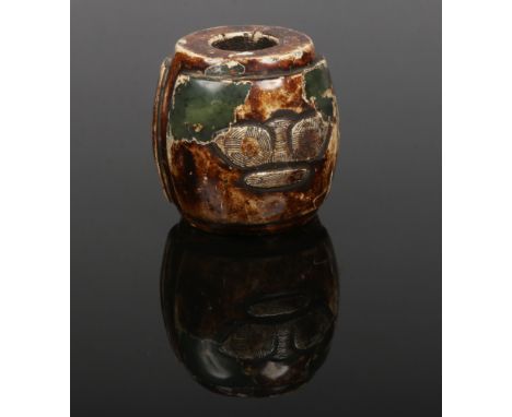 A Chinese altered jade carving of barrel form. With two panels decorated with archaistic motifs, 6cm.Condition report intende