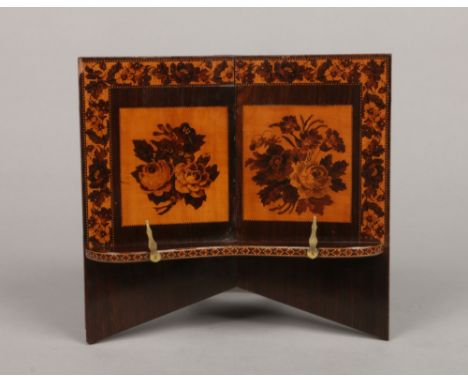 A Victorian rosewood and Tunbridge inlaid book stand, 24cm high.Condition report intended as a guide only.Strut broken off bu