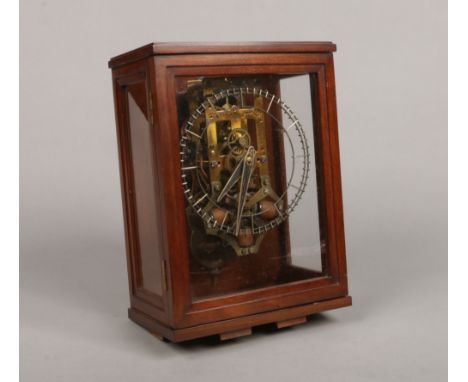 A mahogany cased patent electric skeleton clock by the Self Winding Clock Company of New York. Housing an SWCC style "C" rota