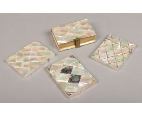 Three Victorian parquetry inlaid mother of pearl card cases, two with abalone shell inlay along with a similar prayer book.Co