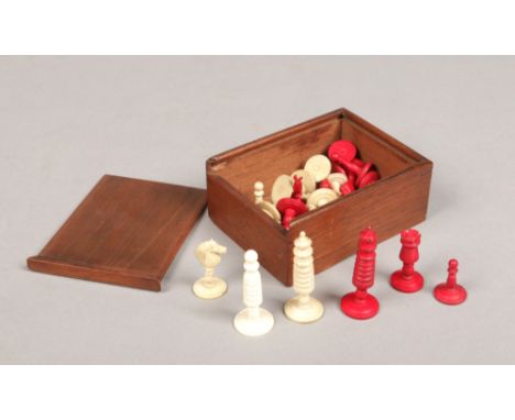 An early 20th century Indian export carved bone and ivory polychrome miniature chess set in wooden box with sliding lid. King