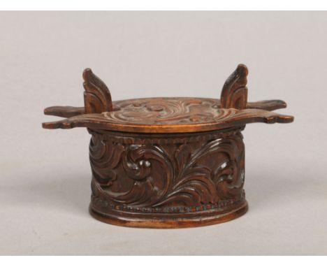 A Norwegian carved treen snuff box with leaf scrolls formed as a dry storage / butter box, 11cm.