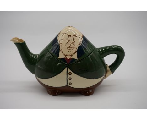 A Foley 'Intarsio' novelty Joseph Chamberlain teapot and cover, by Frederick Rhead, 11cm high.&nbsp;&nbsp; 