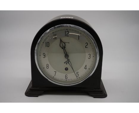 A 1930s War Department brown Bakelite mantel timepiece, by Smiths, with broad arrow mark to dial, 20cm high, with key and pen
