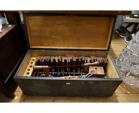 A matched set of carpenters' planes; together with other related woodworking tools, all enclosed within an ebonized trunk, 91