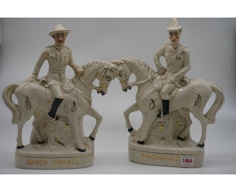 A pair of Staffordshire pottery figures of 'Baden Powell' and 'MacDonald', 38.5cm high.&nbsp; 