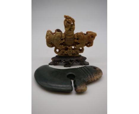 A carved jade hand tool,&nbsp;possibly Antipodean, 20.5cm long; together with a Chinese soapstone vase and cover, 16.5cm high