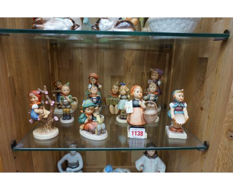 Twelve Hummel figures.&nbsp; 
