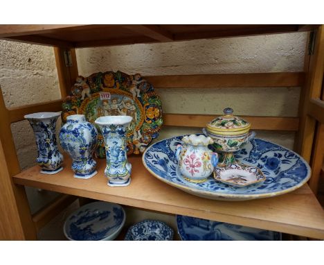 A collection of tin glazed pottery, to include: a maiolica plate, 29.5cm wide; and Delftware. (8) 