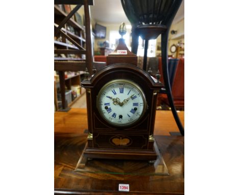 A late 19th century mahogany and inlaid musical mantel clock, with enamel dial, chiming on five gongs, 49cm high, with pendul