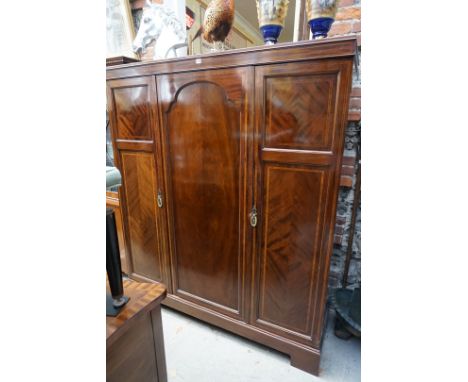 An early 20th century mahogany and inlaid triple wardrobe,&nbsp;154cm wide.&nbsp; 