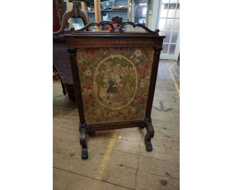 A 19th century rosewood and inlaid fire screen, with embroidered tapestry panel, 62.5cm wide. 