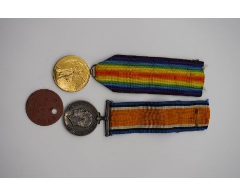 Medals: a World War I pair, comprising: War Medal and Victory Medal, to 335384 Pte D G King, 7-Lond R; with related dog tag. 