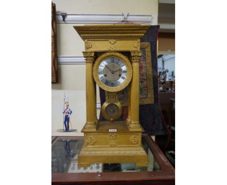 A large and impressive French Empire style gilt brass portico clock,&nbsp;the silvered dial inscribed 'Guillemin, R. St Honor