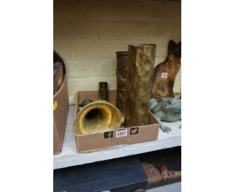 A small collection of brassware, comprising: a bugle, by Couesnon &amp; Cie; three trench art vases, largest 26.5cm high; and