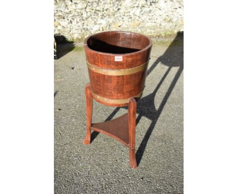 A brass bound planter, labelled 'R A Lister &amp; Co Ltd'. 