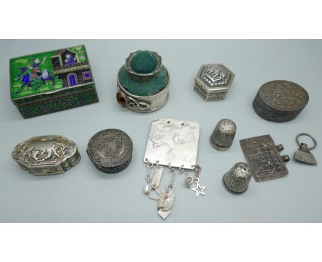 An Eastern silver and enamel pot, four silver and white metal pill boxes, two silver thimbles, a plated stick pin cushion, et