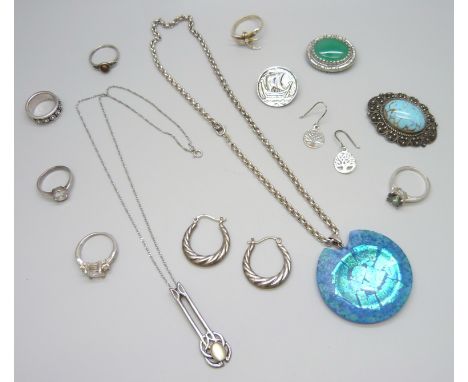 An Art Nouveau style silver pendant and chain, a pair of silver hoop earrings, a silver brooch, plated ship brooch, .950 silv