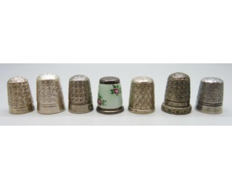 Four silver thimbles including a guilloche enamel example and Charles Horner, together with three other thimbles