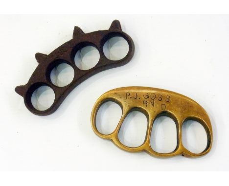 Two WW1 British knuckle dusters, one stamped  "P. J. Goss RND 1915"